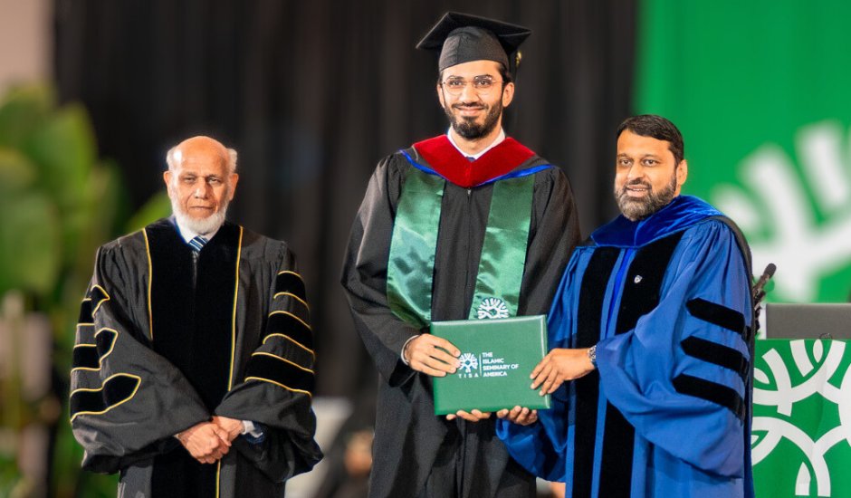 TISA graduate receiving diploma at commencement